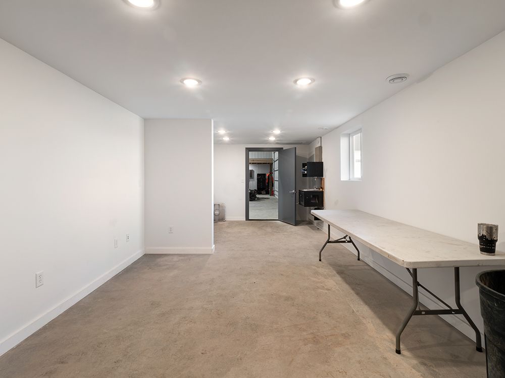 There is a table in the middle of the room.