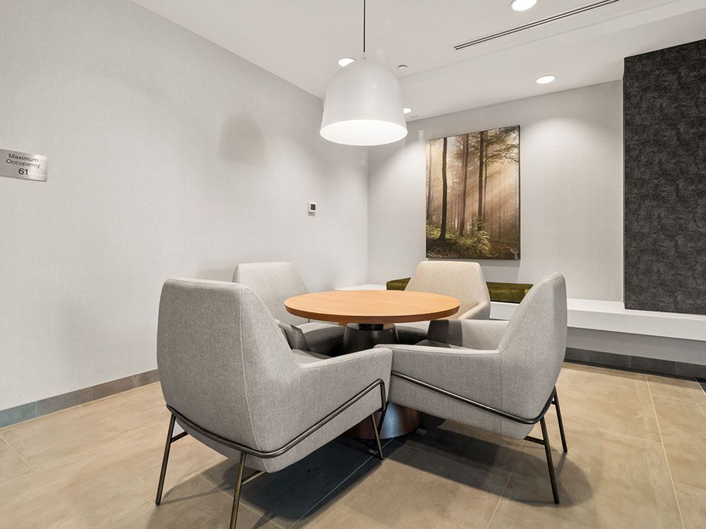 A room with a table and chairs in it.