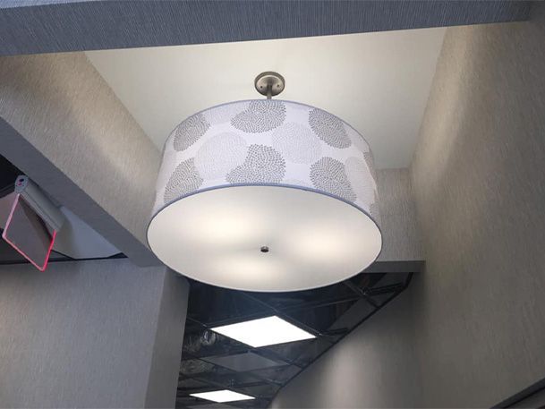 A light hanging from the ceiling in a hallway
