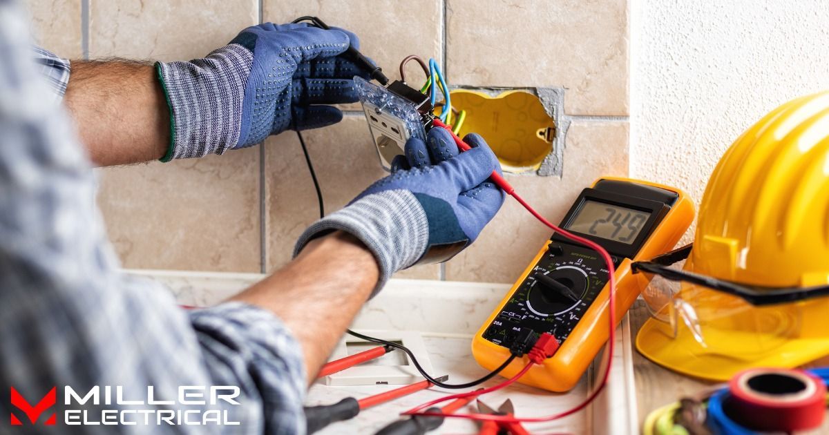 A man is working on an electrical outlet with a multimeter.