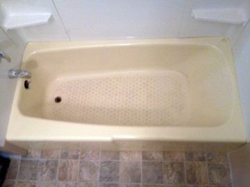 A kitchen counter with two sinks and a cutting board