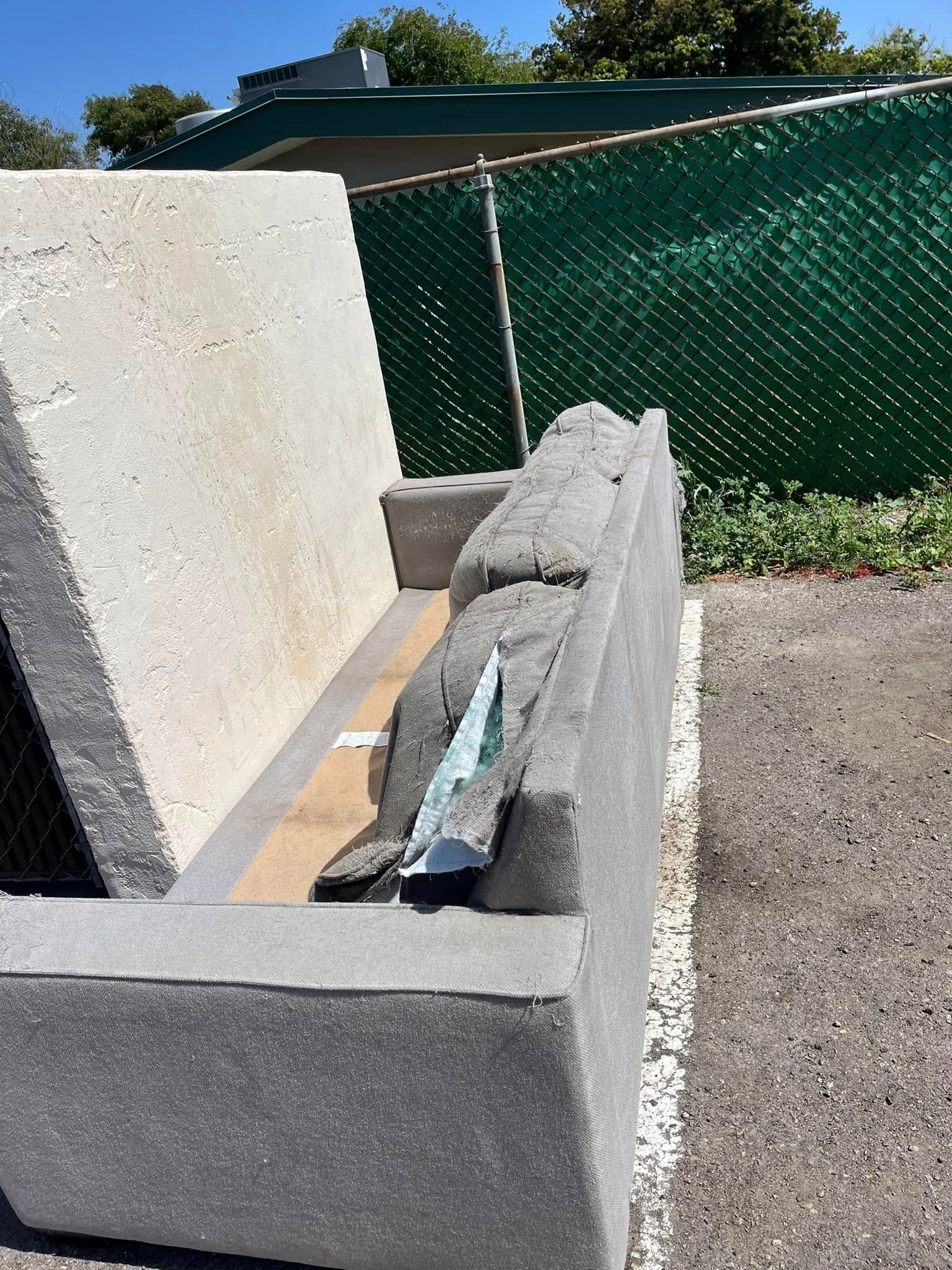 Concrete blocks displayed outdoors; gray and beige tones, sunlight. Some blocks forming a bench-like structure.
