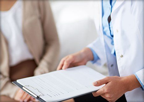 Dentist talking to patient