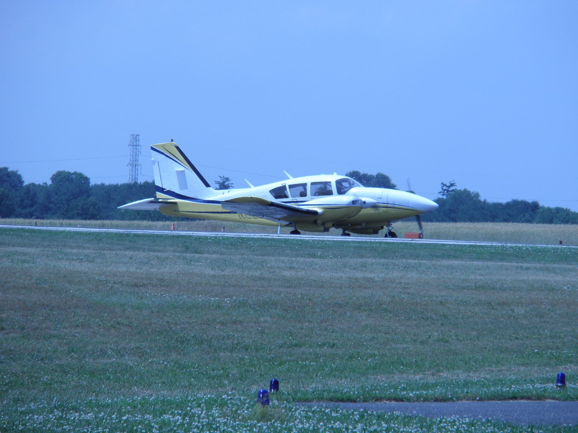 a small plane is sitting on a grassy runway