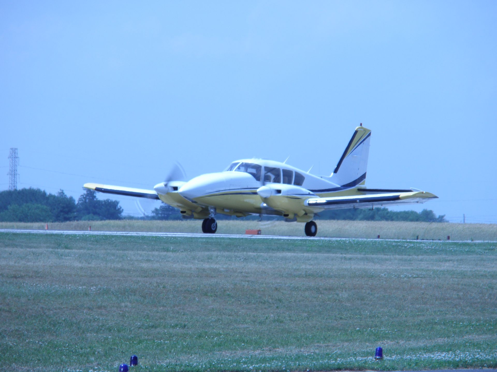 a small plane is taking off from an airport runway