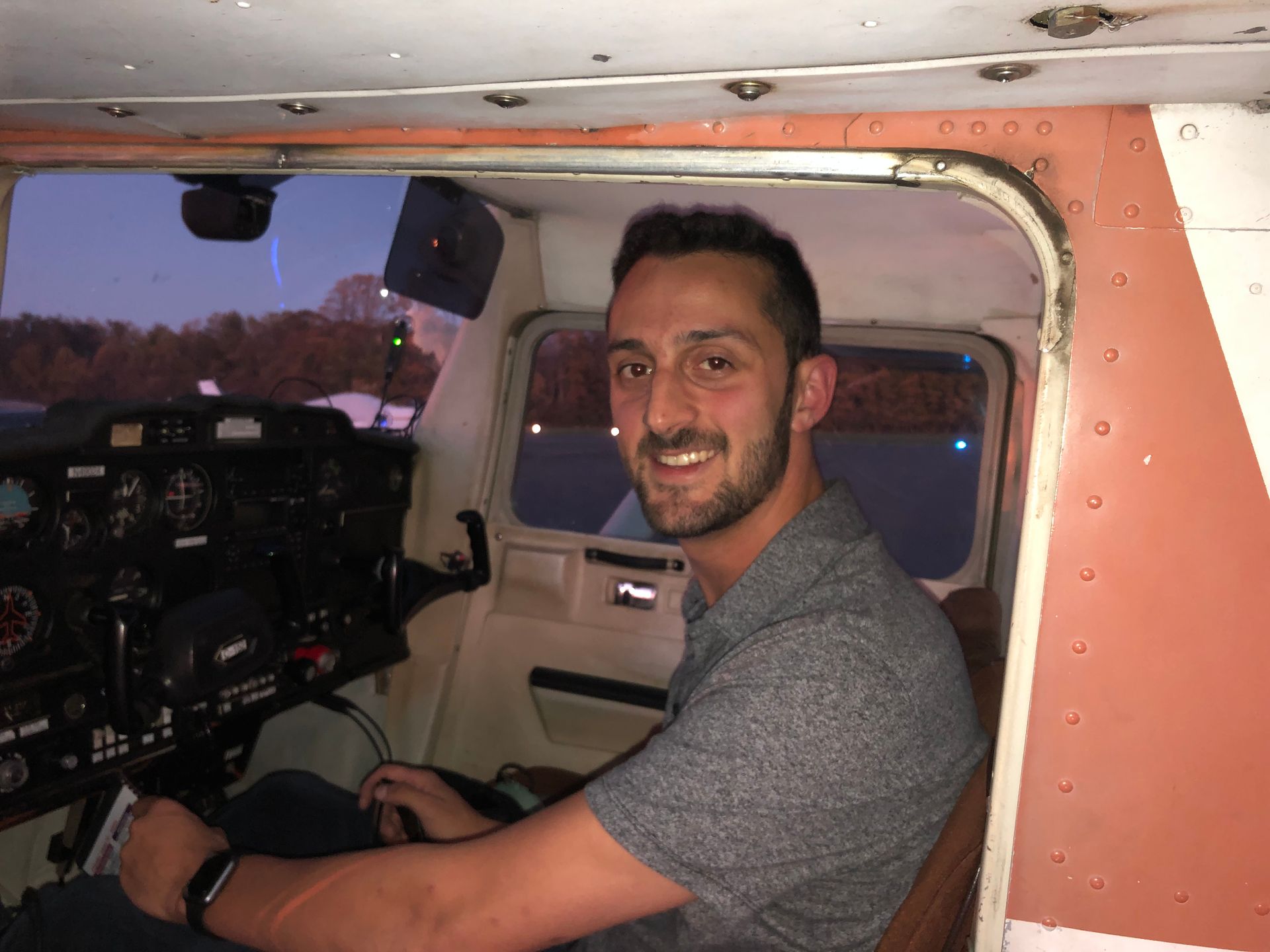 a man is sitting in the cockpit of an airplane
