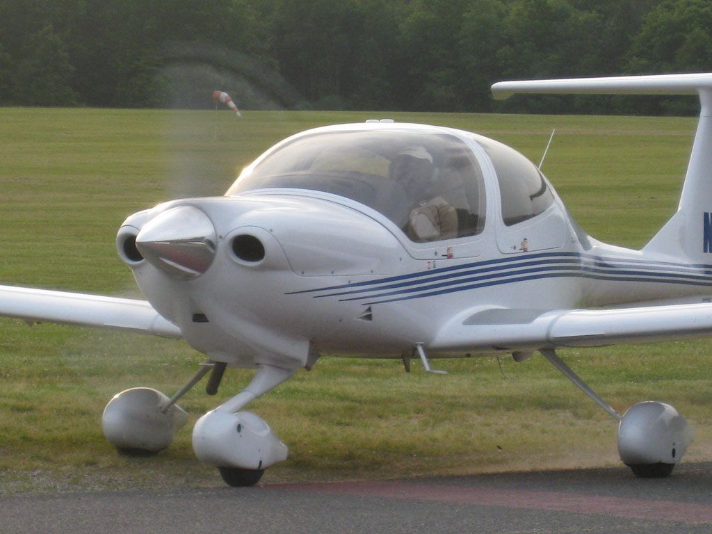 a small plane with the letter m on the tail
