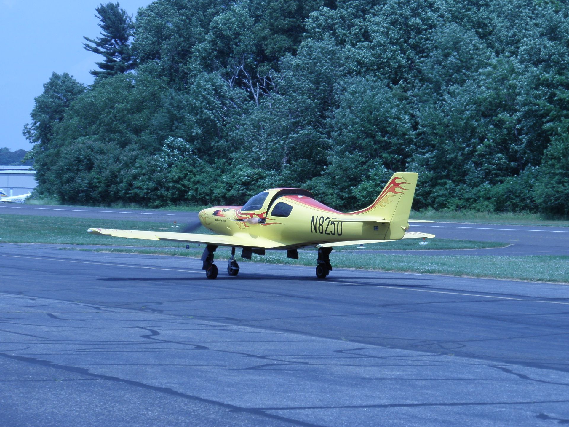 a small yellow plane with the letters n351 on the tail