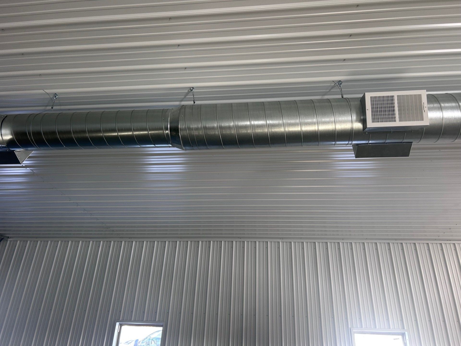 Churning ocean water, turquoise and white, forming a wave.