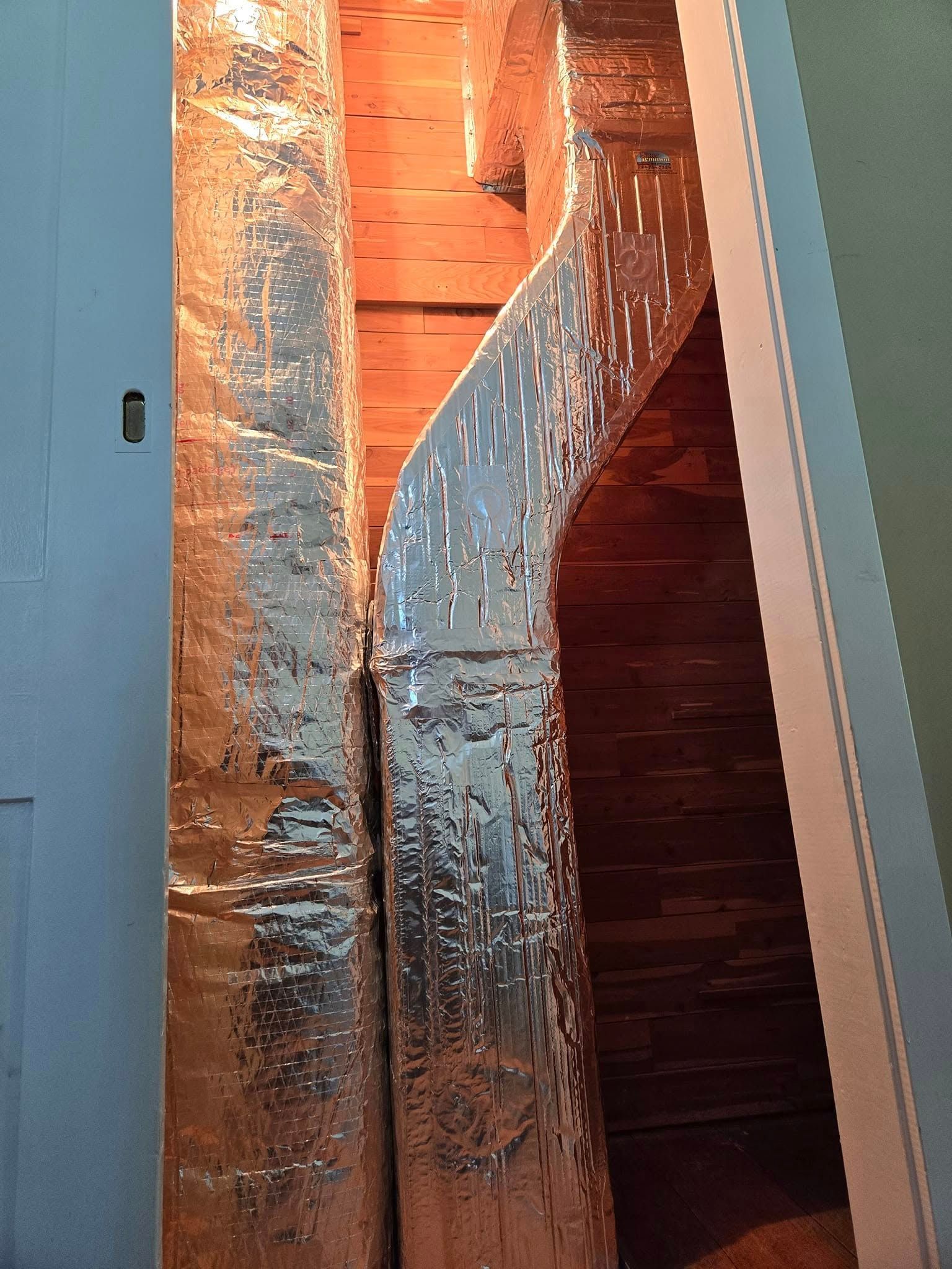 Sandy surface with long, curved shadows.