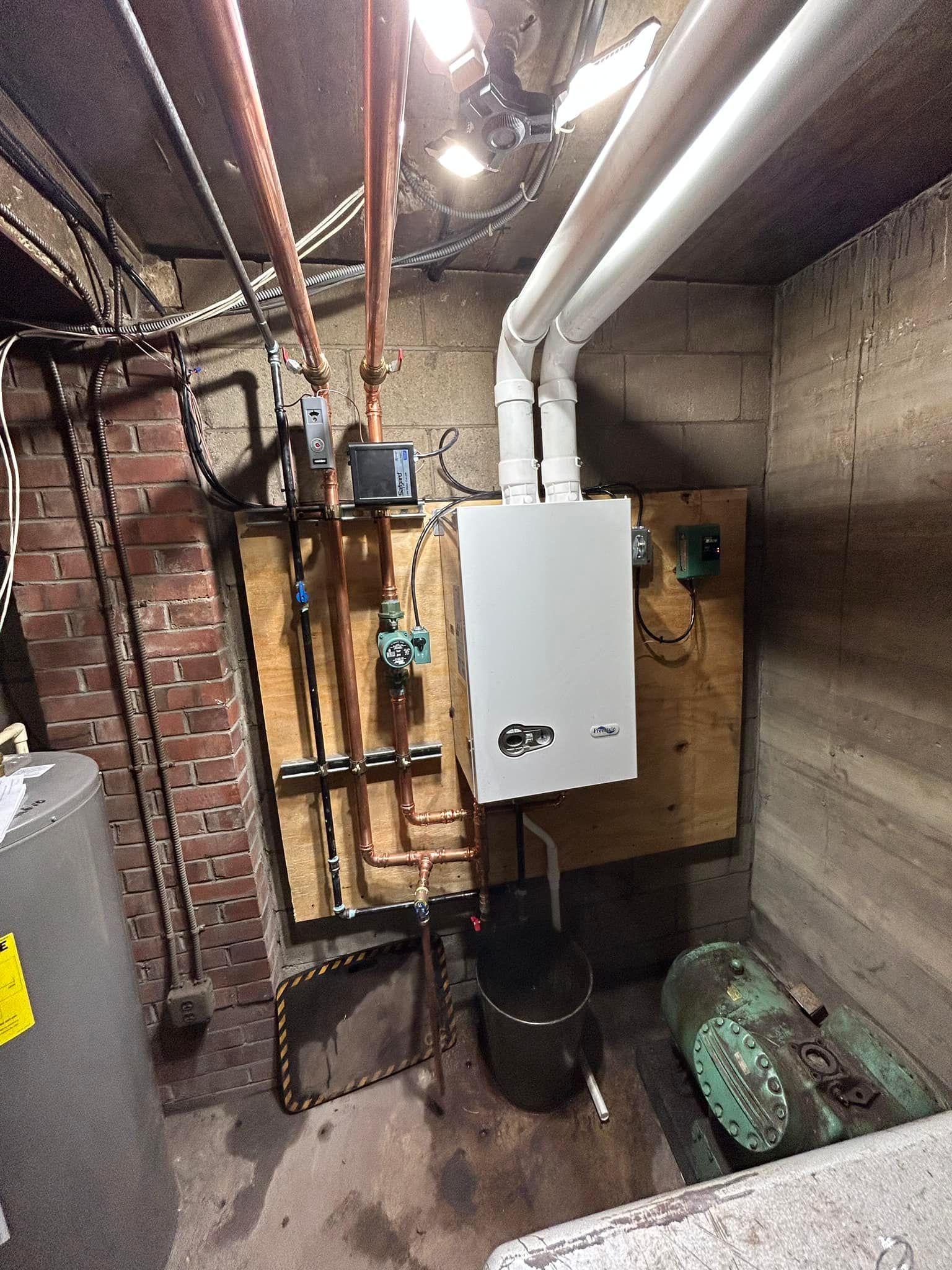 Aerial view of a winding river flowing through a lush green forest.