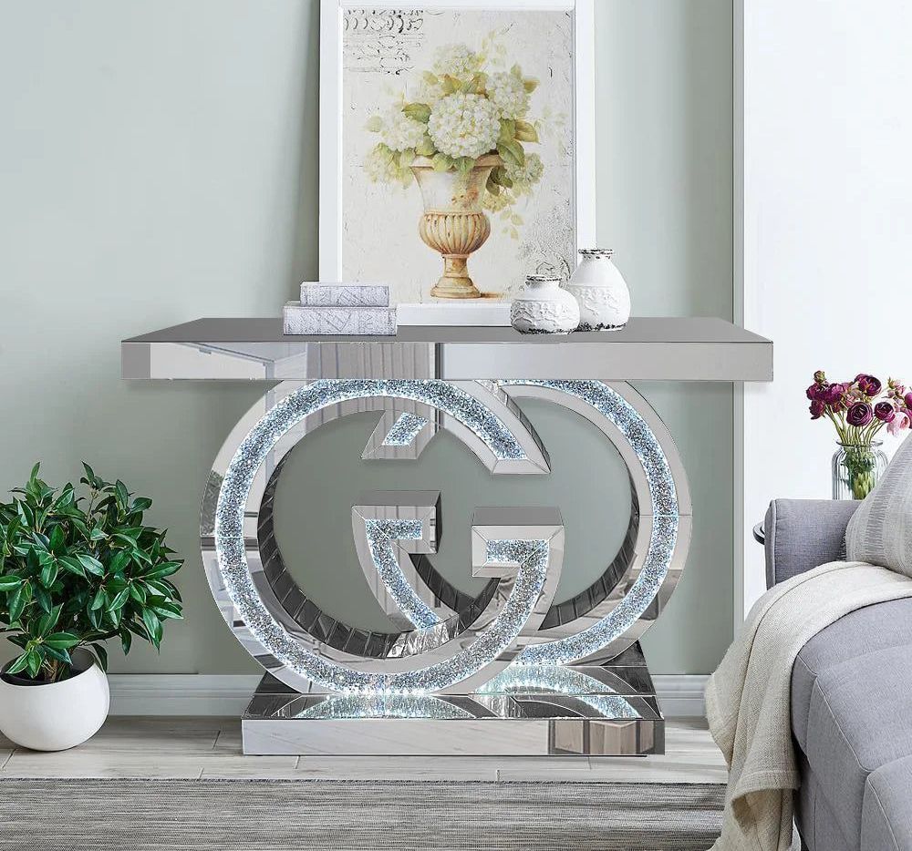 A living room with a couch and a table with a g on it