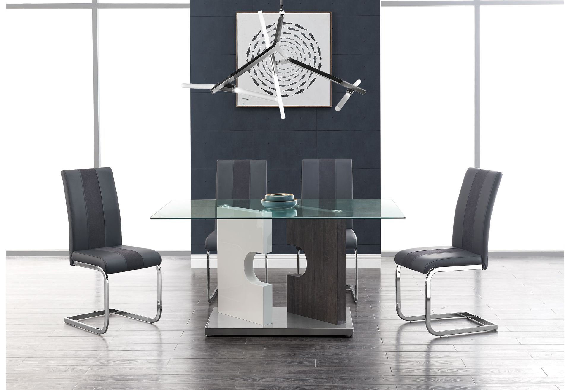 A dining room with a glass table and chairs