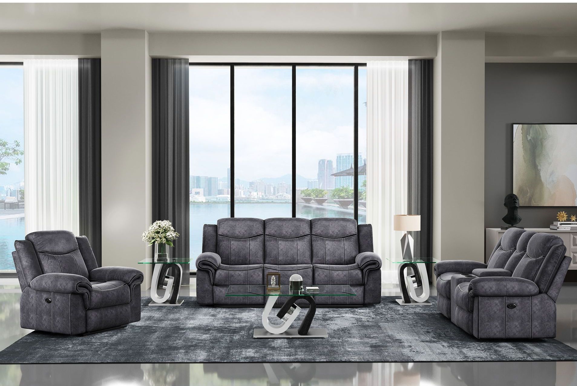 A living room with a couch , two chairs , a coffee table and a rug.