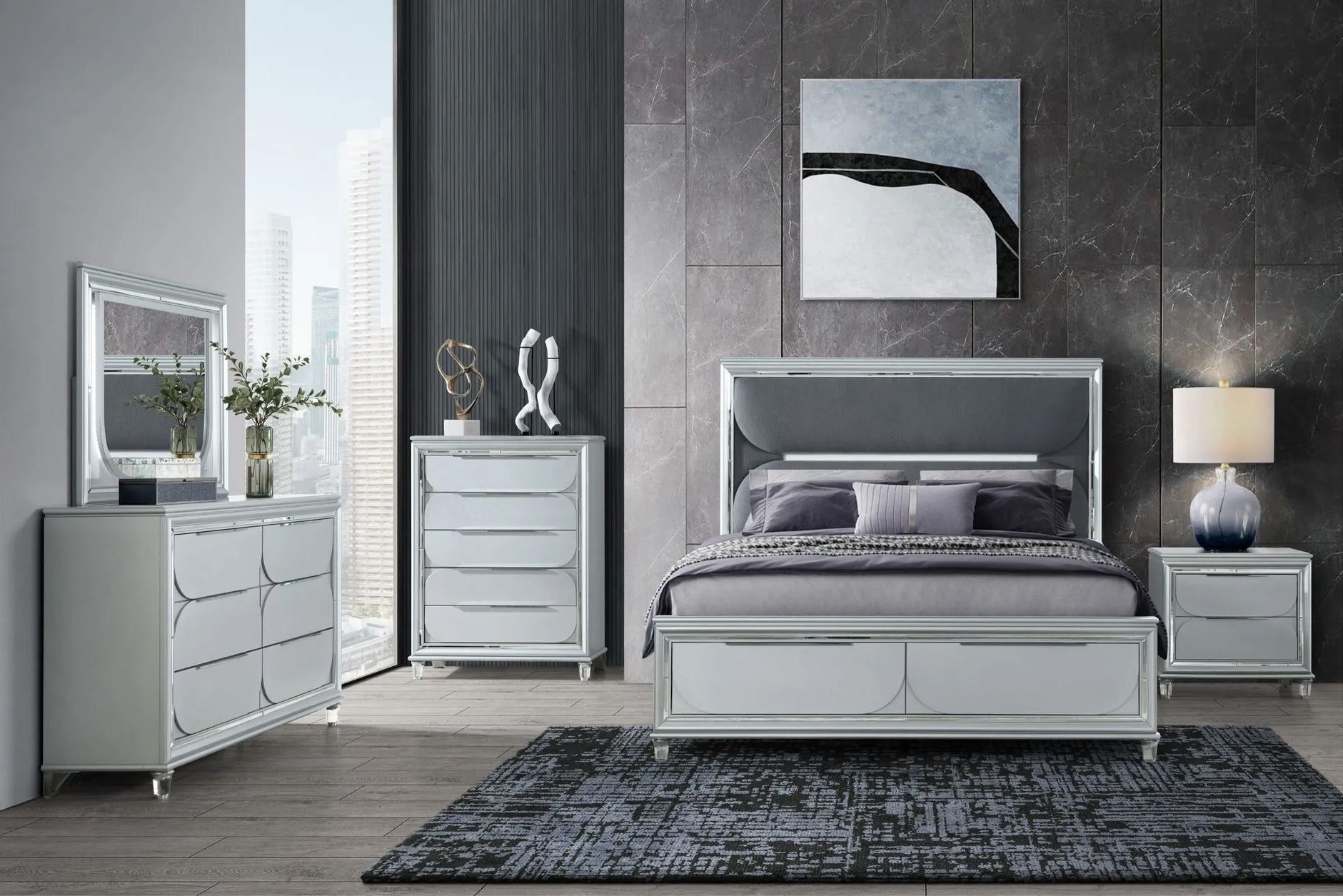 A bedroom with a bed , dresser , nightstand , mirror and rug.
