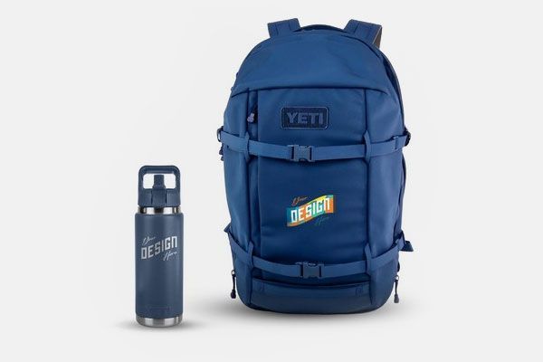 A blue yeti backpack is next to a blue water bottle.