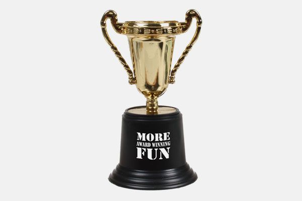 A gold trophy with the words more fun written on it