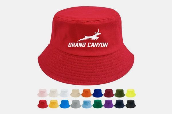 A red bucket hat with the word grand canyon on it