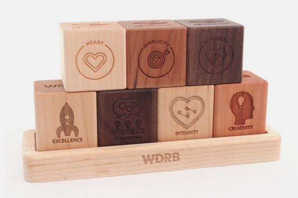 A stack of wooden blocks with various symbols on them.
