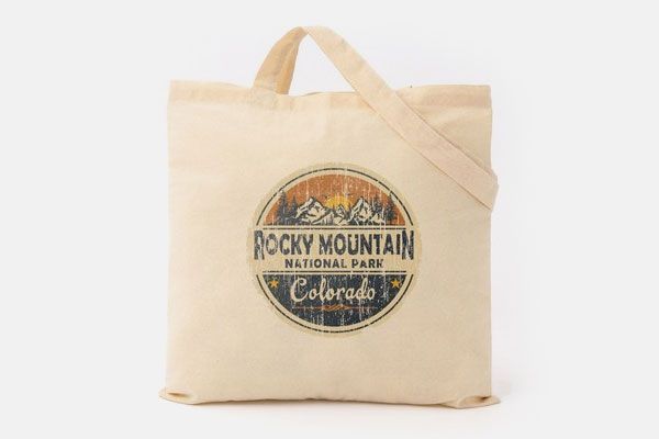 A tote bag with a rocky mountain national park logo on it.
