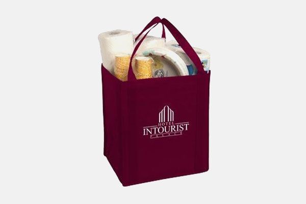 A burgundy bag with the word tourist on it