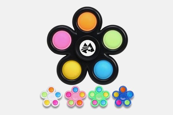 A fidget spinner in the shape of a flower with different colors.
