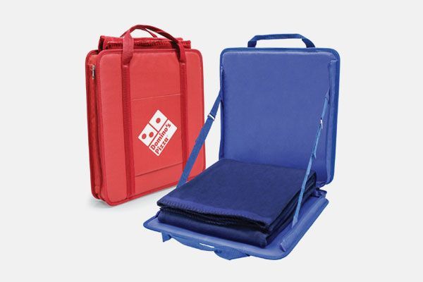 A red domino 's bag sits next to a blue domino 's bag