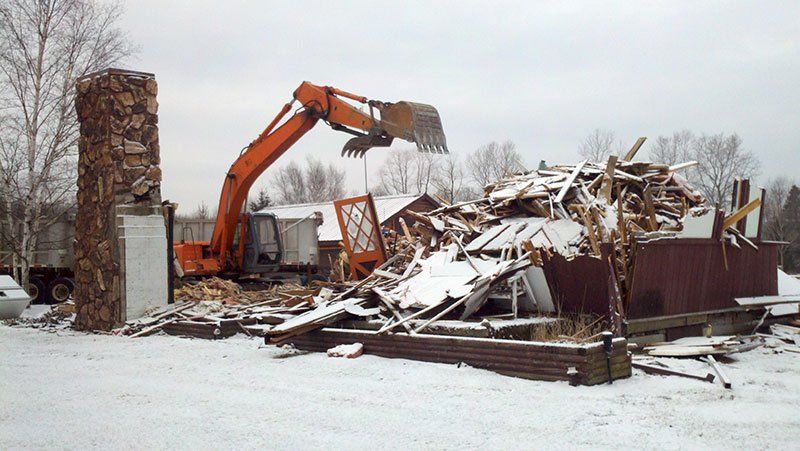 equipment demolishing the house