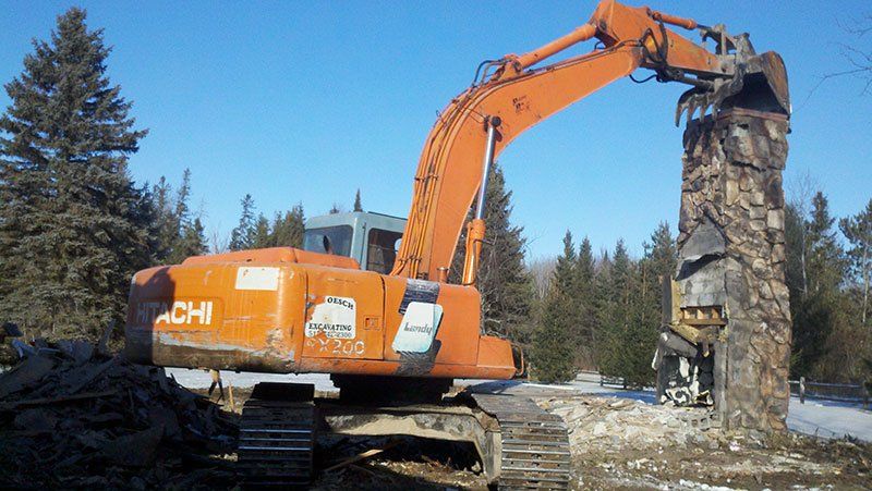 equipment demolishing the chimney