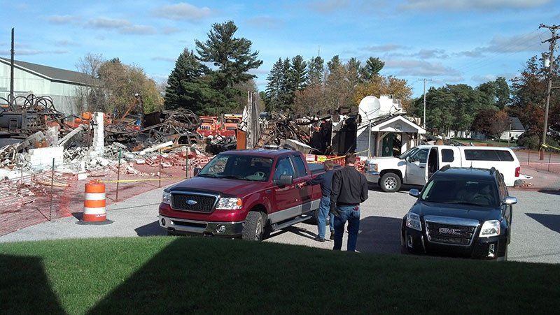cars near the demolition site