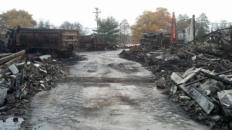 scrap metal on either side of the driveway