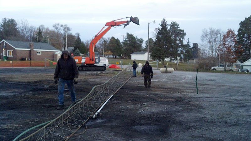 high metal tower on the ground near the equipment