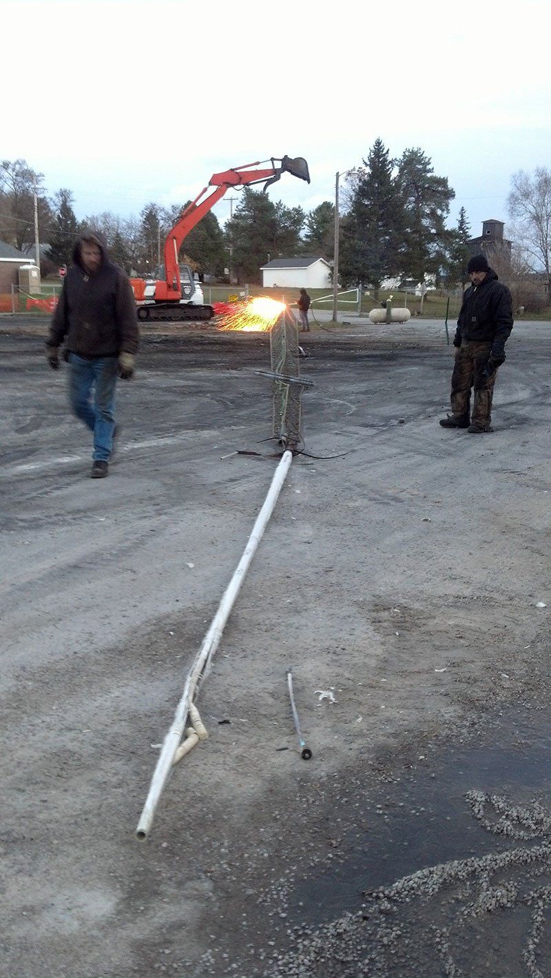 white metal bar on the ground