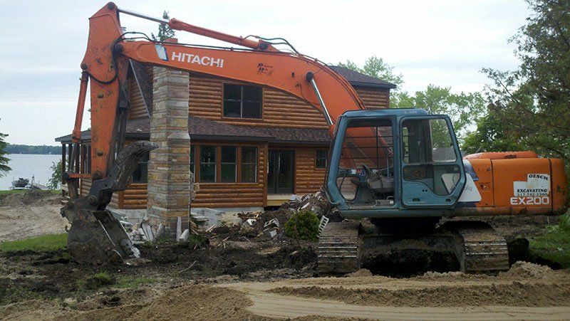 equipment demolishing the chimney