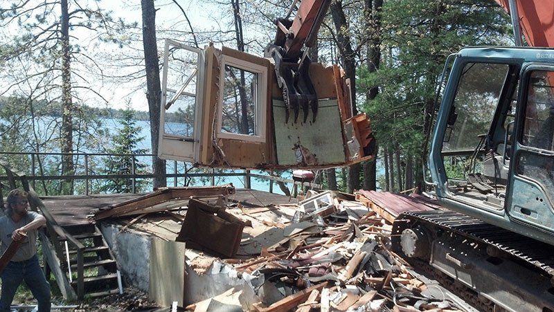 equipment lifting a part of the lake house