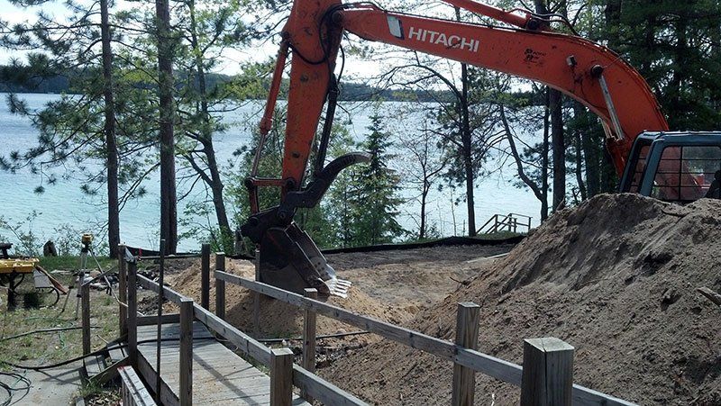 demolition equipment near the lake