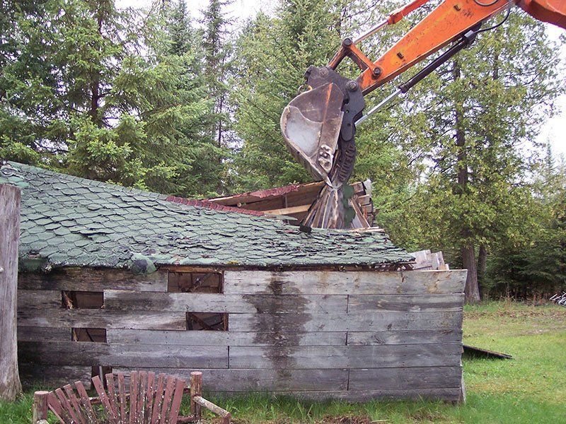 demolishing the small cabin