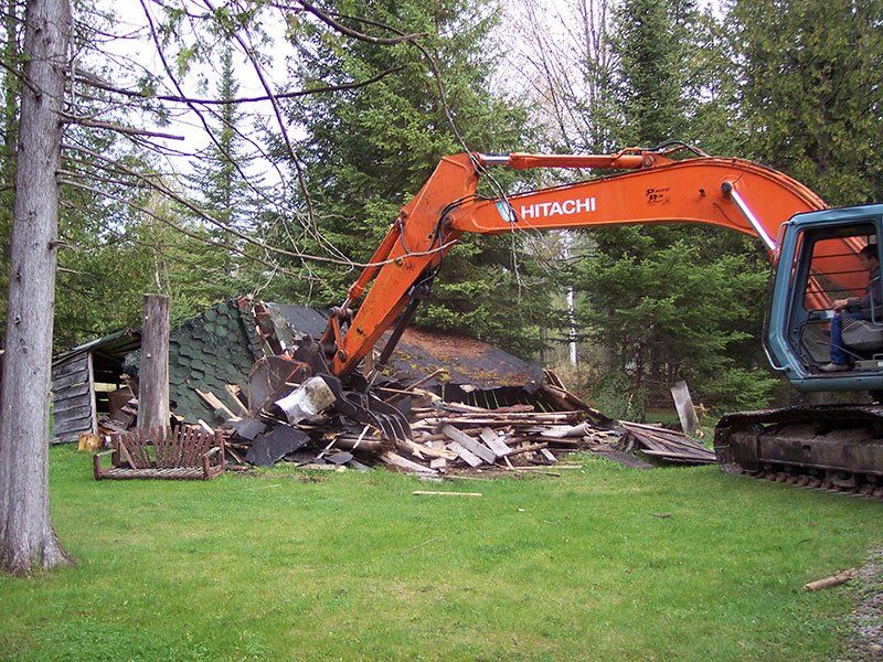 small cabin getting demolished