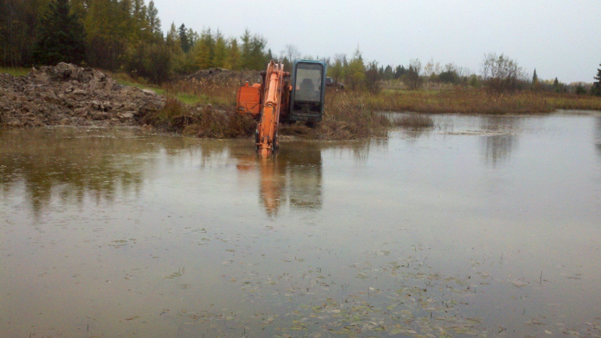 heavy-duty equipment by the pond