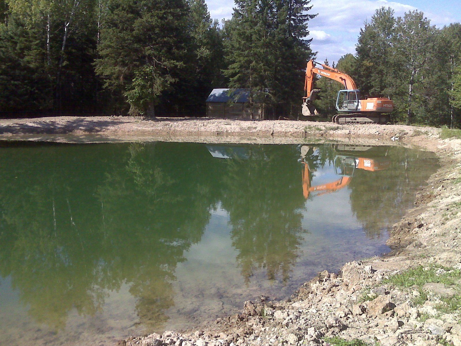 heavy-duty equipment near the pond