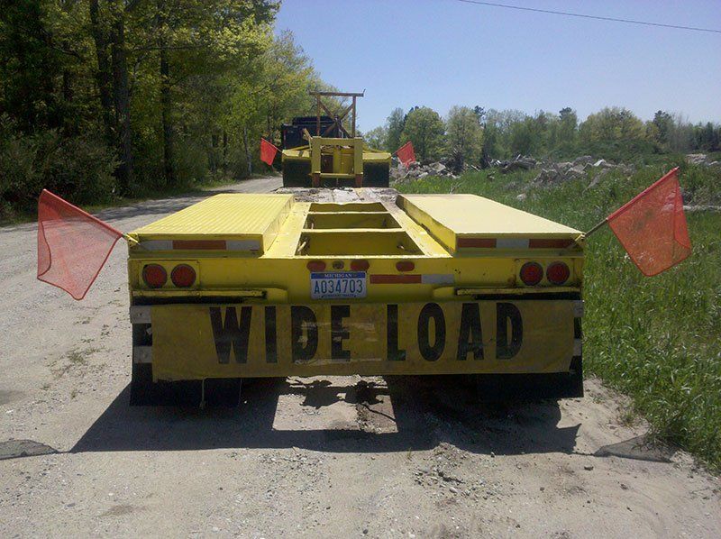 yellow wide load truck