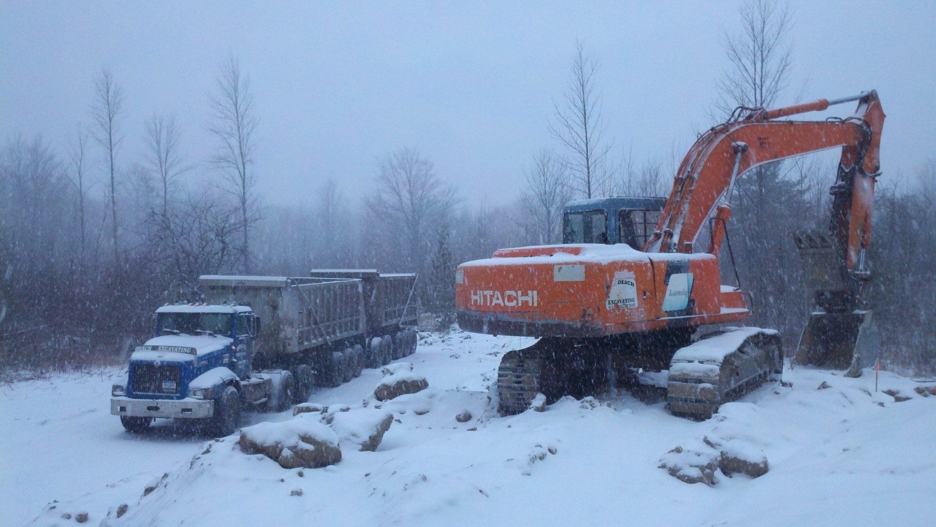 truck and heavy equipment in snow