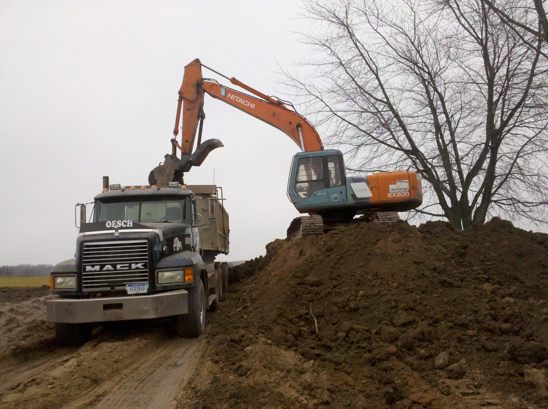 heavy equipment and truck for lot clearing project