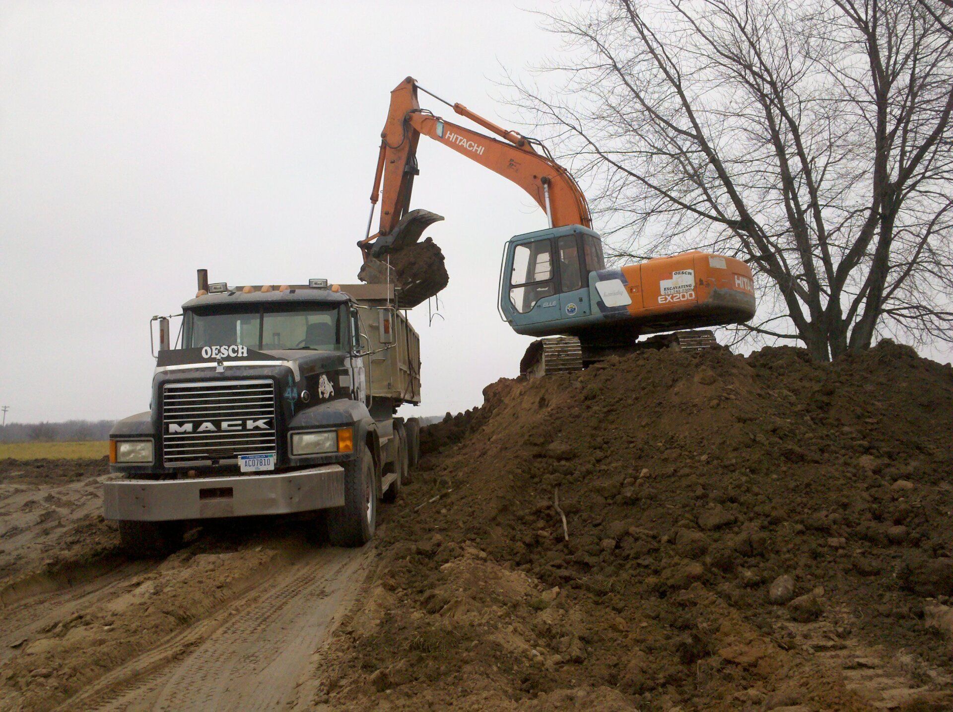 heavy equipment and truck for lot clearing service