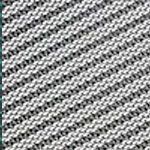 Diagonal black and white textured knit fabric.