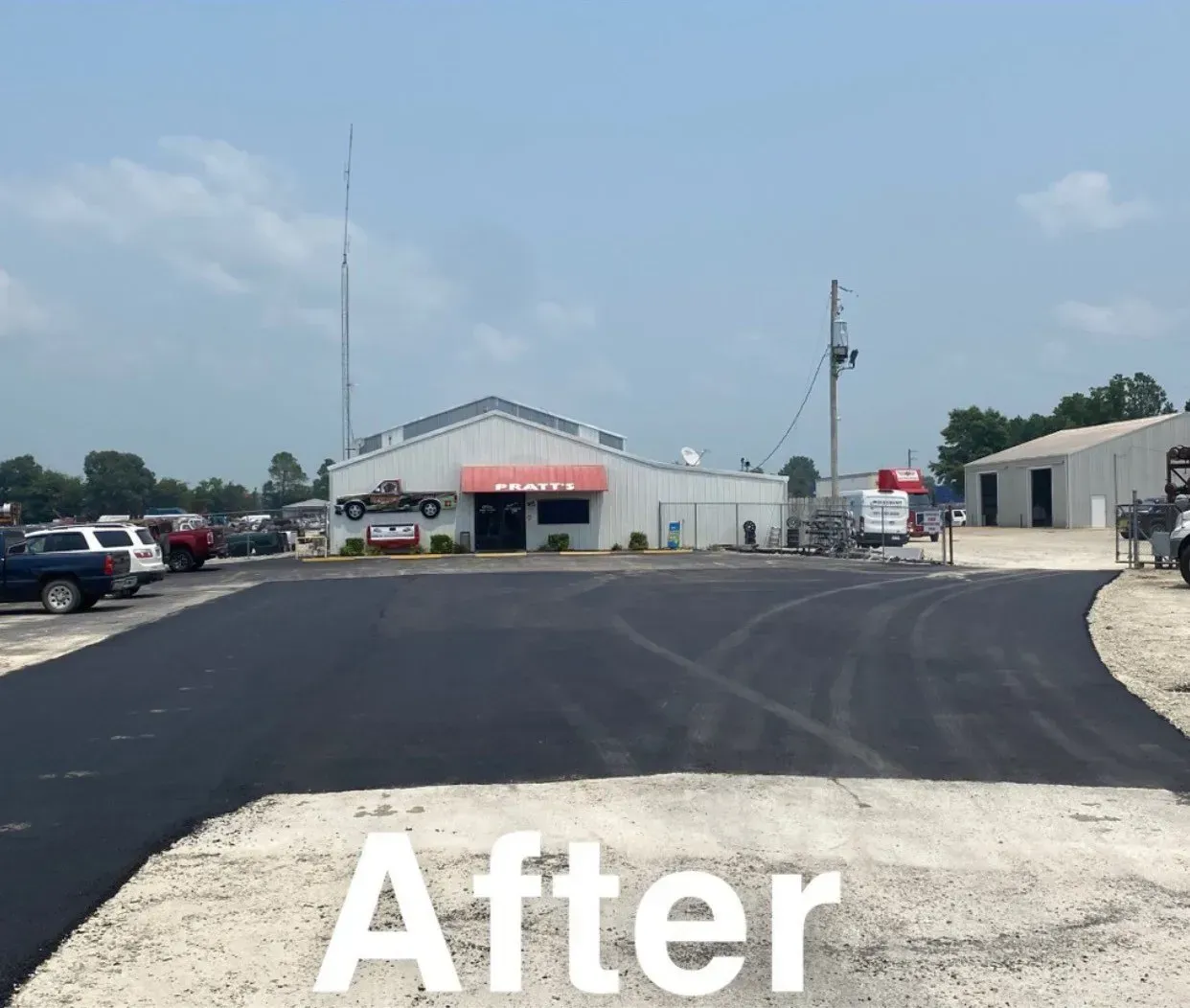 Freshly paved parking lot outside a small white building under a clear sky, labeled “After”