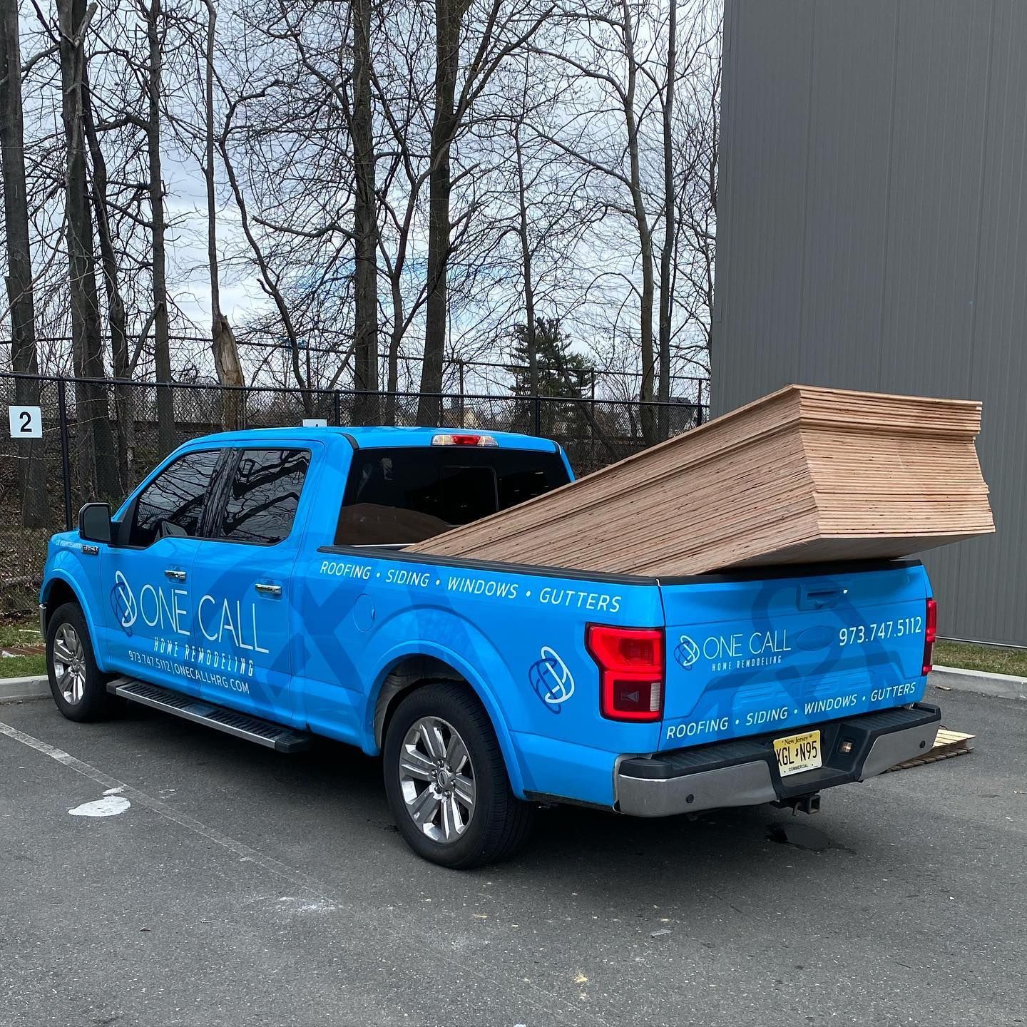 A blue truck with the word bone call on it