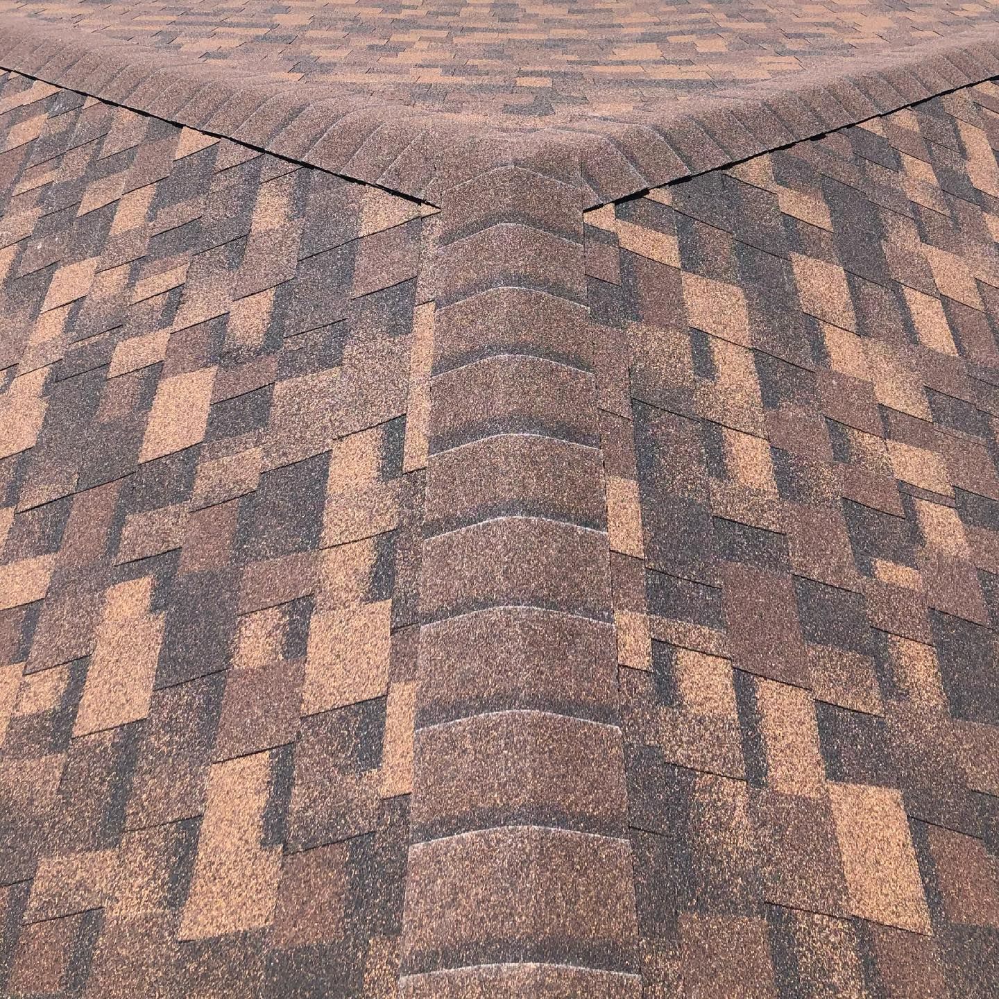 A close up of a roof with shingles on it
