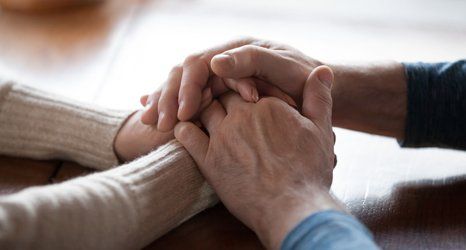 Holding an elderly hands