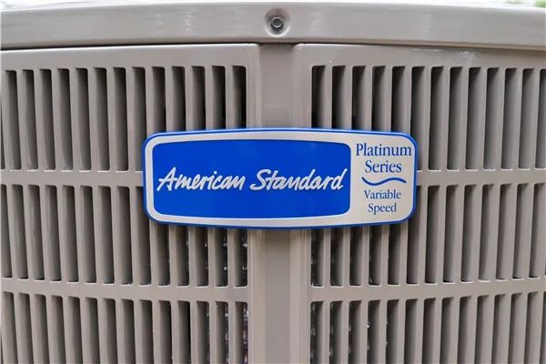 American Standard air conditioning unit, Platinum Series, in gray.